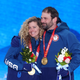Lindsey Jacobellis and Nick Baumgartner teamed up to take the first mixed snowboarding cross event gold.